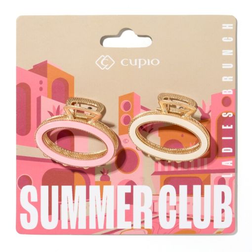 Zwei Haarspangen von Cupio auf einer Verpackung im Sommer-Club-Stil