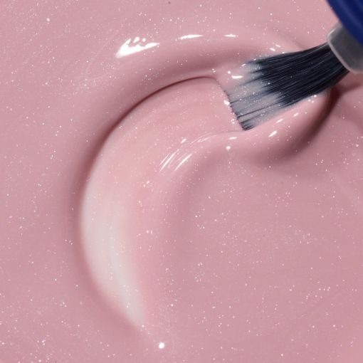 Rosa Nagellack mit funkelndem Glitzer und Pinsel